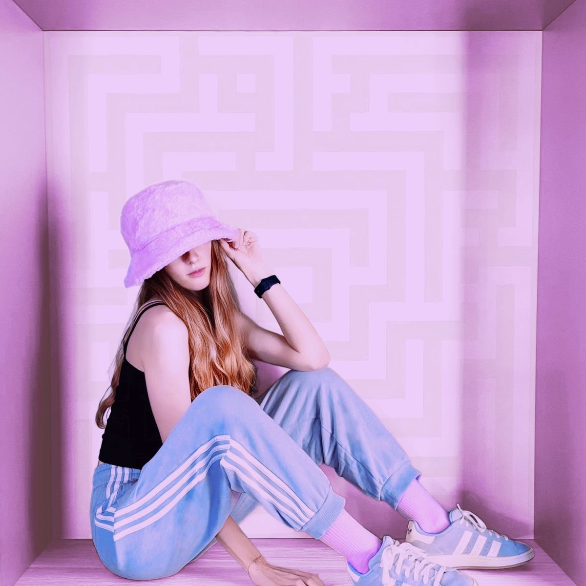 HAYLEEN, French electropop artist, sitting inside a maze for her project Mind Maze